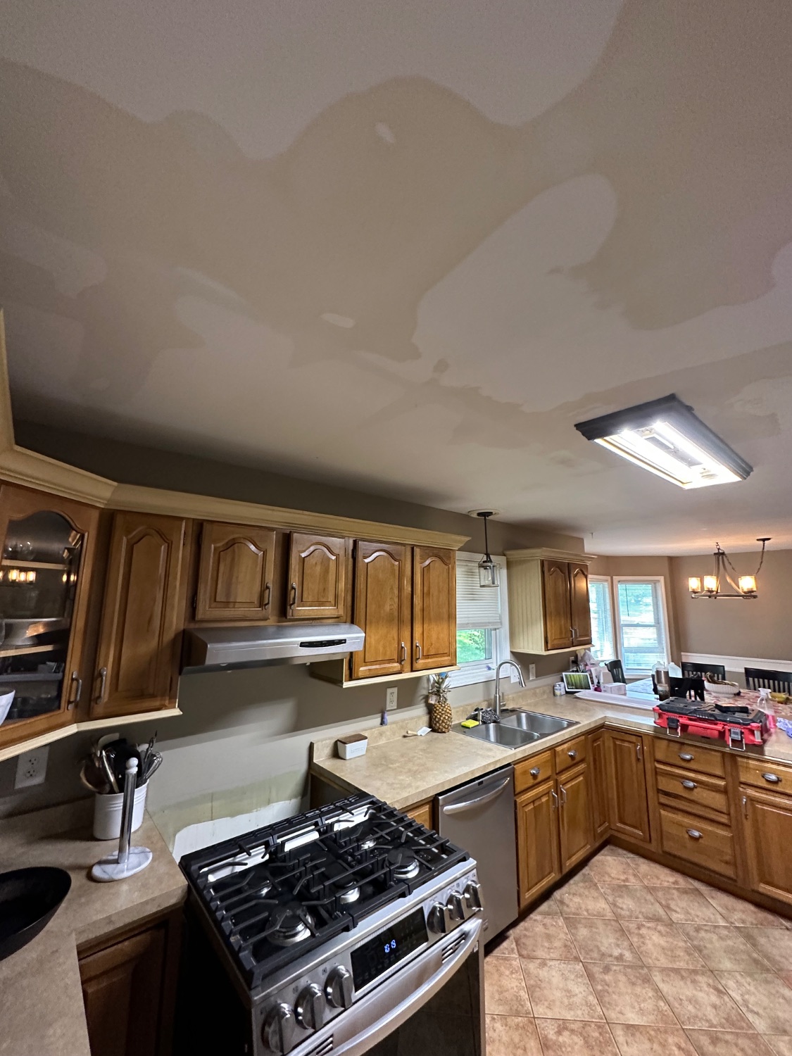Water-stained kitchen ceiling before repair